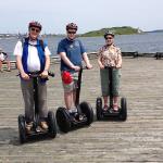 Edgar, Julia and Sam on Segways at Halifax harbor boardwalk