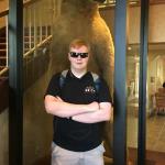 Samuel with bear in lobby of Anchorage hotel