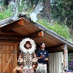 Students model native Alaskan clothing during Chena River riverboat tour