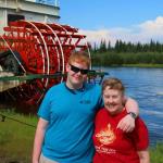 Sam and Julia in front of paddlewheel riverboat docked at Chena River village