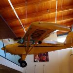 Episcopal bishop's plane for visiting churches in remote areas on display in Morris Thompson Cultural and Visitors Center in Fairbanks