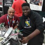 Mr. Hicks and Mamadou in the pits