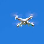 Quadcopter in flight over rugby field at Furman