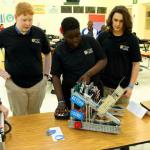 Justin, Sam, Mamadou and Grant work on the Robotigers 1320D team robot