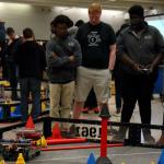 Sam, Mamadou and Gabe watch 1320C robot take autonomous with mobile goal scored in 20 point zone at the Berkmar HS VEX tournament on February 17, 2018