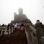 Sam gets a slight lead on his parents climbing the 268 steps to the base of the fog shrouded Giant Buddha