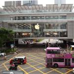 Multi-level, glassy overpass Apple Store at IFC Mall crowded with customers
