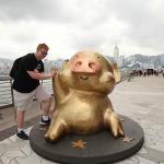 Sam with statue of Hong Kong's most famous cartoon pig, McDull, on Avenue of Stars