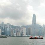 Two Star Ferry Co. ferries crossing Victoria Harbor as viewed from Tsim Sha Tsui waterfront, oldest ferry operation in Honng Kong