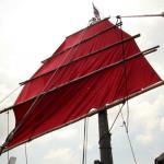 Iconic red sail of Aqua Luna