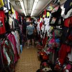Sam bargains for tee shirts in Stanley Market