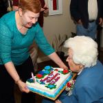 Grandmother Burke blows out candles on her 90th birthday cake