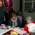 Jane Baxter with Beth Baxter Smith and Mike Smith opening packages