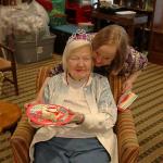 Julia's Furman University roommate Sandy Smith who recently moved to Tucker hugs Grandmother at birthday party