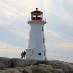 Julia and Sam beside Peggy's Cove lighthouse near Halifax, Nova Scotia