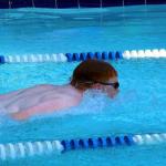 Sam swimming butterfly leg of 13-14 medley relay against Winding Vista