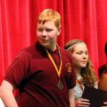 Sam on stage at Top 10% Banquet at Tucker Middle School, May 7, 2015
