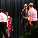 Sam shakes hands with Dr. Eric Parker, prinicipal of Tucker HS