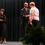 Sam shakes hands with Dr. Eric Parker, principal of Tucker HS
