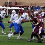 Nick Arbuckle hands off ball to running back against Texas State, November 14, 2015