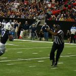Referee runs to avoid GSU receiver Glenn Smith with the ball