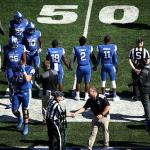 GSU HC Shawn Elliott shakes official's hand before start of game