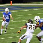 Will Lutz punts rugby style against App State