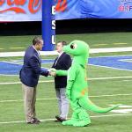 GSU AD Charlie Cobb greets the GEICO gecko during break in the game