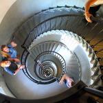 Julia and Sam on spiral staircase inside Ponce Inlet Lighthouse as seen from near the top