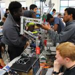 Working on 1320C In The Zone robot prior to first match of South Forsyth HS tournament