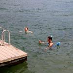 Tom, Julia and John try to entice Millie to jump in the lake